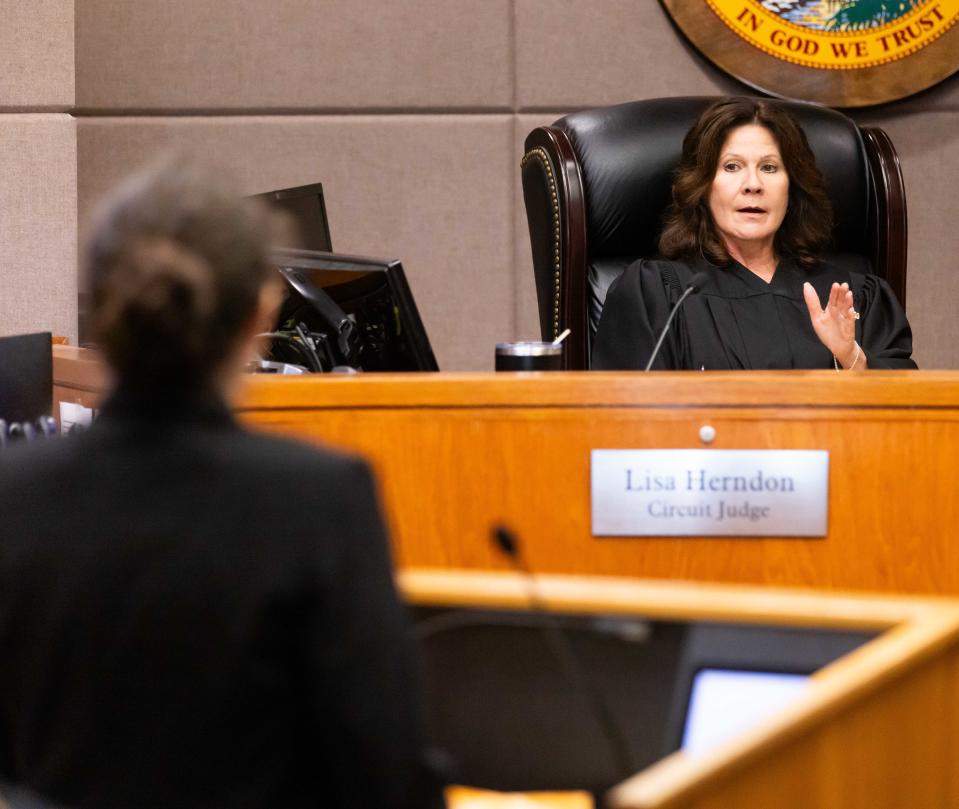 Circuit Judge Lisa Herndon speaks to Neely Raye Pesognellie Petrie Blanchard in court.
