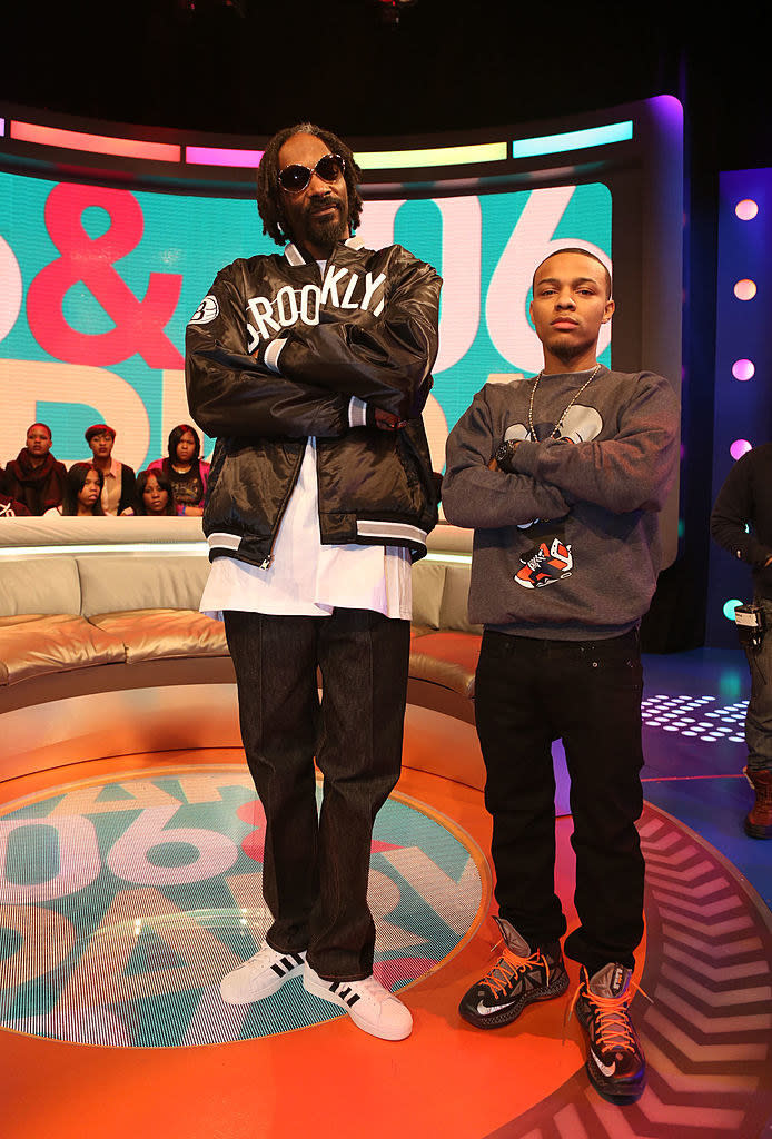 Snoop and Bow Wow standing with arms folded