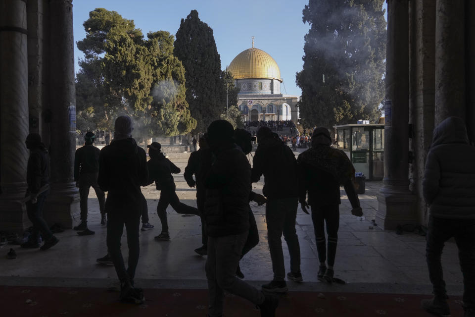 Palestinians clash with Israeli security forces at the Al Aqsa Mosque compound in Jerusalem's Old City Friday, April 15, 2022. (AP Photo/Mahmoud Illean)