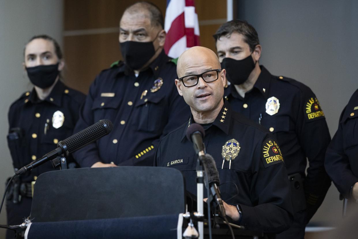Chief Eddie Garcia, middle, speaks with media during a news conference regarding the arrest and capital murder charges against Officer Bryan Riser at the Dallas Police Department headquarters on Thursday, March 4, 2021, in Dallas.