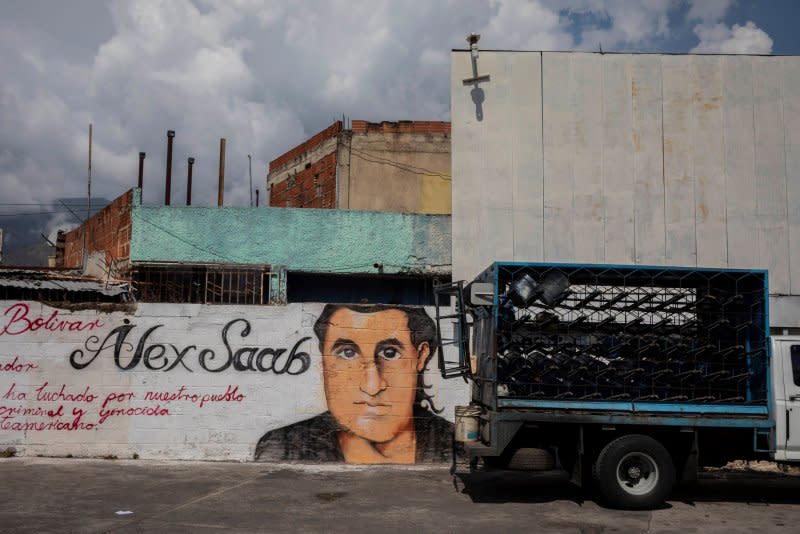 The Biden administration said Wednesday 10 Americans held by Venezuela are coming home. In exchange, Alex Saab, a close ally of Venezuelan President Nicolas Maduro is being released. Saab's face is seen on a mural in Caracas, Venezuela, in 2021. File Photo by Rayner Pena/EPA-EFE