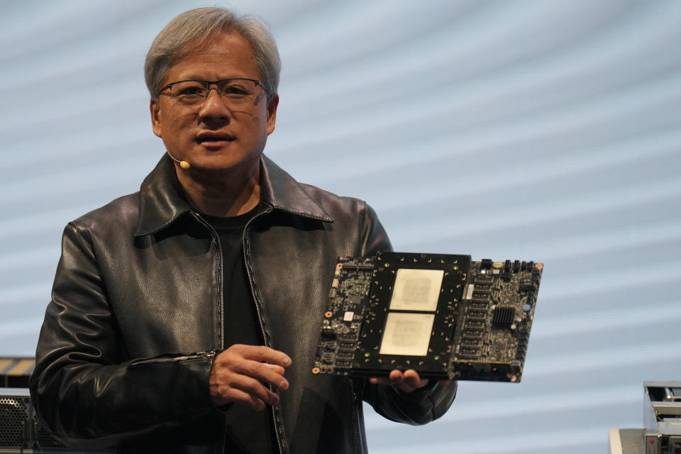 TAIPEI, TAIWAN - 2023/06/01: Jensen Huang, President of NVIDIA holding the Grace hopper superchip CPU used for generative AI at supermicro keynote presentation during the COMPUTEX 2023. The COMPUTEX 2023 runs from 30 May to 02 June 2023 and gathers over 1,000 exhibitors from 26 different countries with 3000 booths to display their latest products and to sign orders with foreign buyers. (Photo by Walid Berrazeg/SOPA Images/LightRocket via Getty Images)