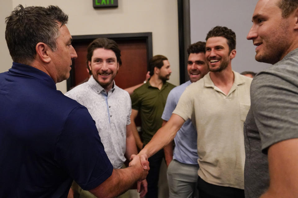 Nashville Predators new head coach Andrew Brunette, left, visits with his players Matt Duchene, Dante Fabro, Roman Josi and Colton Sissons, right, following a news conference at the NHL hockey team's arena Wednesday, May 31, 2023, in Nashville, Tenn. (AP Photo/George Walker IV)