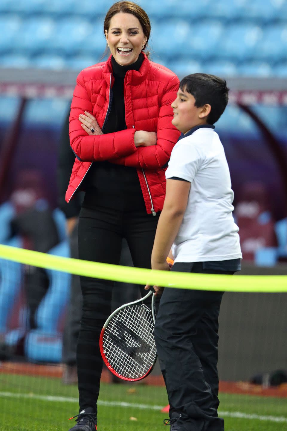 <p>The Duchess watches a tennis lesson while visiting the Aston Villa Football Club to see the work of the Coach Core program.</p>