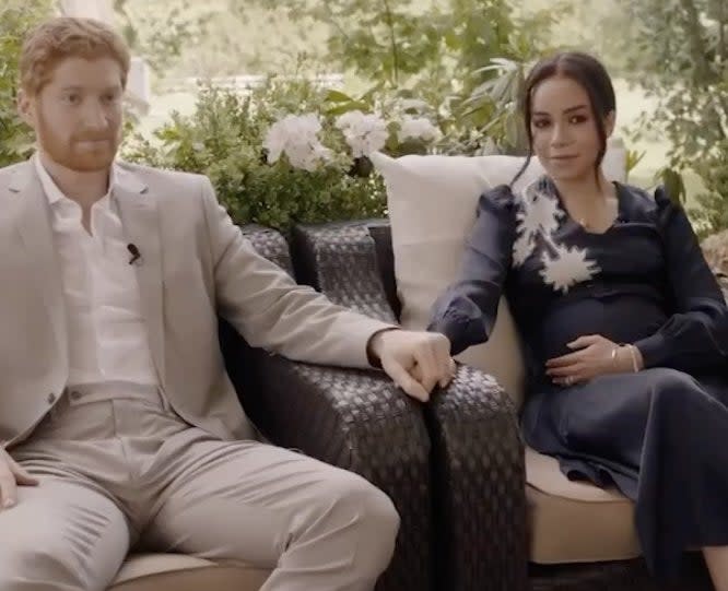 A screenshot from the movie where Meghan and Harry are interviewed