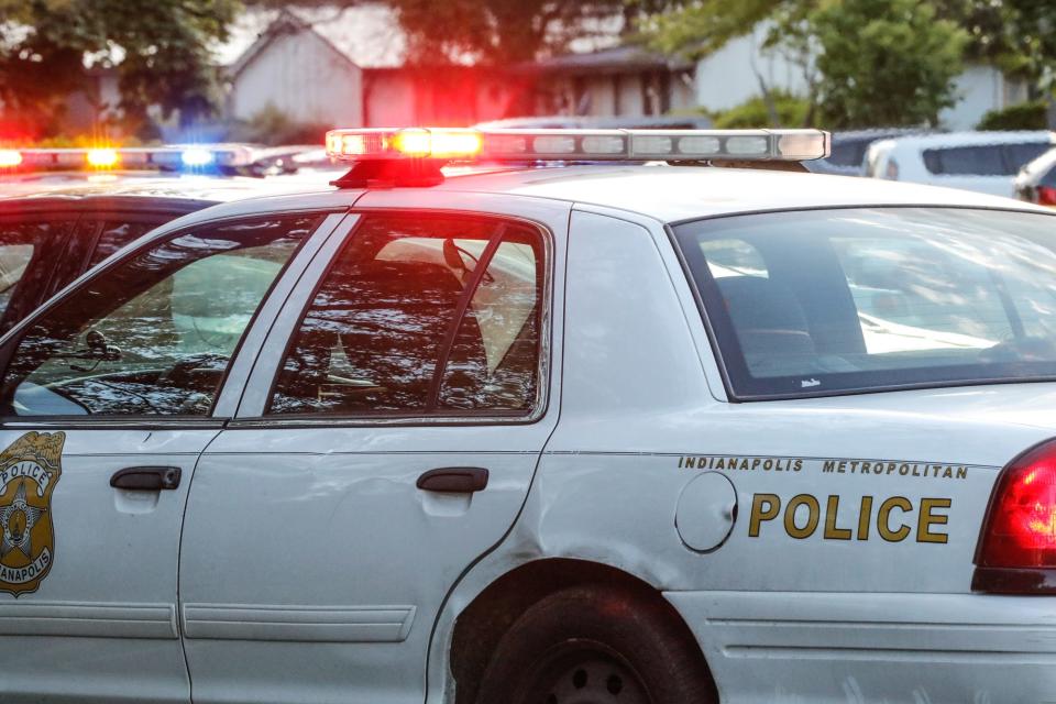 Indianapolis Metropolitan Police Department patrol cars at a crime scene.