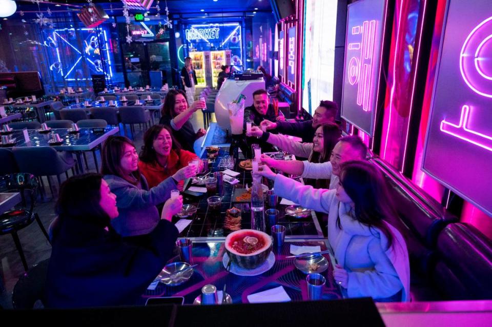 A group of friends and colleagues from Connie Van Real Estate Group dine at the newly opened Z Town Asian Gastro Bar in Elk Grove on Jan. 12.