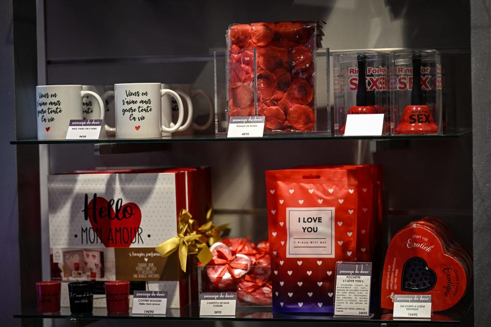 This photograph taken in Paris, on February 9, 2024, shows gift sets, mugs and service bells displayed at the "Passage du Desir" love store and sex shop. A vibrator instead of flowers, a clitoral stimulator instead of a candlelit dinner: sex toys are the gift of choice for Valentine's Day. (Photo by Miguel MEDINA / AFP) (Photo by MIGUEL MEDINA/AFP via Getty Images)