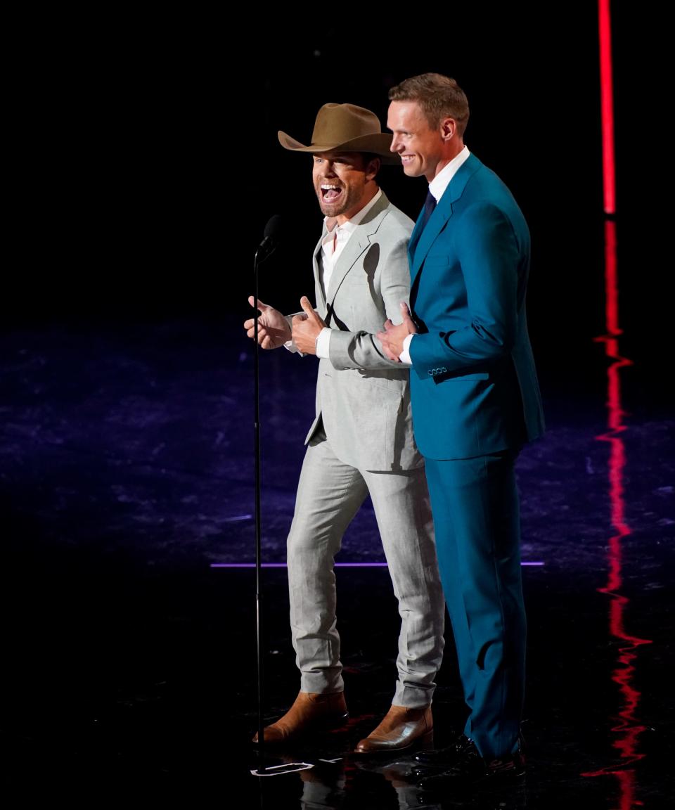 Dustin Lynch and Pekka Rinne appear on stage during the NHL Awards at Bridgestone Arena on Monday, June 26, 2023, in Nashville, Tennessee.