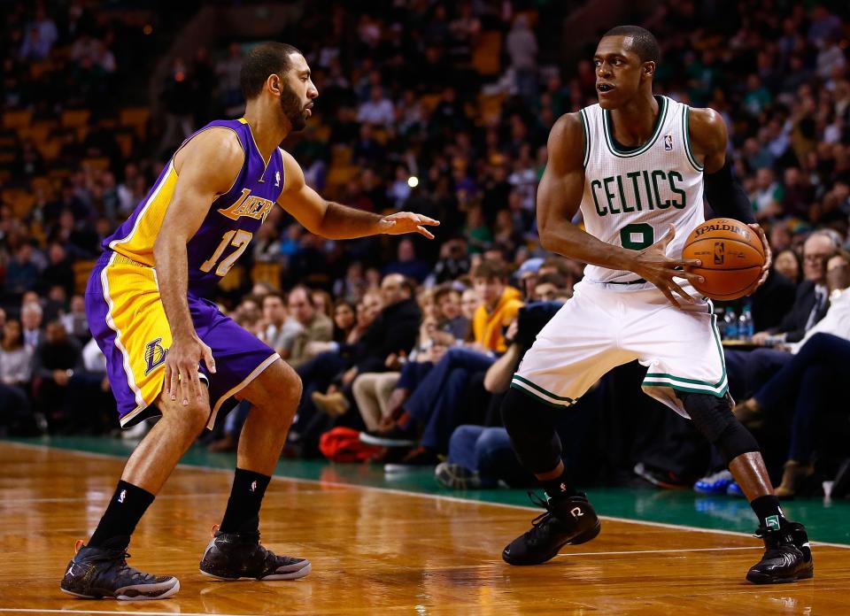 BOSTON, MA - JANUARY 17: Rajon Rondo #9 of the Boston Celtics handles the ball in front of Kendall Marshall #12 of the Los Angeles Lakers in the first quarter during the game at TD Garden on January 17, 2014 in Boston, Massachusetts. NOTE TO USER: User expressly acknowledges and agrees that, by downloading and or using this photograph, User is consenting to the terms and conditions of the Getty Images License Agreement.  (Photo by Jared Wickerham/Getty Images)