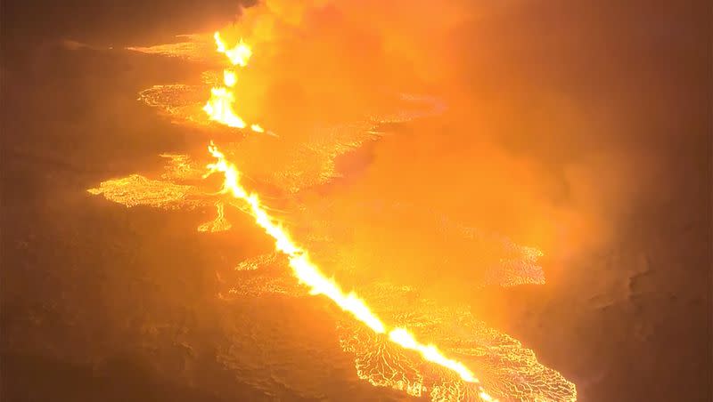 This image made from video provided by the Icelandic Coast Guard shows magma flow on a hill near Grindavik on Iceland’s Reykjanes Peninsula sometime around late Monday, Dec. 18, or early Tuesday, Dec. 19, 2023. A volcanic eruption started Monday night on Iceland’s Reykjanes Peninsula, turning the sky orange and prompting the country’s civil defense to be on high alert.