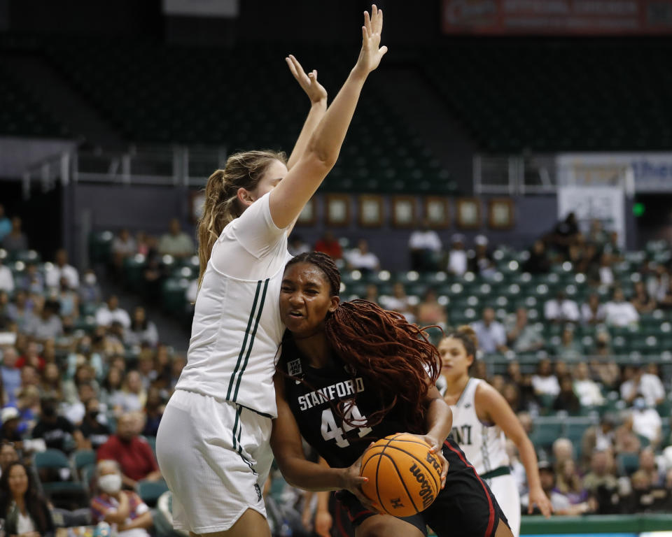 Stanford forward Kiki Iriafen (44) runs into Hawaii forward Kallin Spiller during the third quarter of an NCAA college basketball game, Sunday, Nov. 27, 2022, in Honolulu. (AP Photo/Marco Garcia)