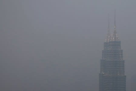 Petronas Twin Towers shrouded by haze in Kuala Lumpur