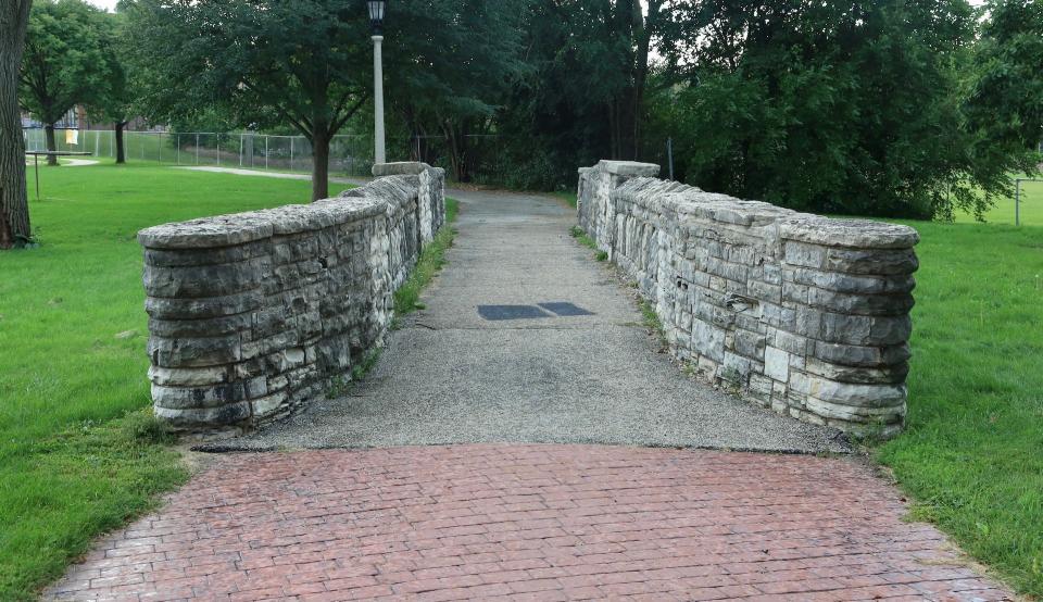 This "bridge to nowhere" was built over flood-prone Honey Creek when New Deal work relief crews widened and lined the stream in the 1930s. Continued flooding convinced authorities to cover Honey Creek in the 1970s.