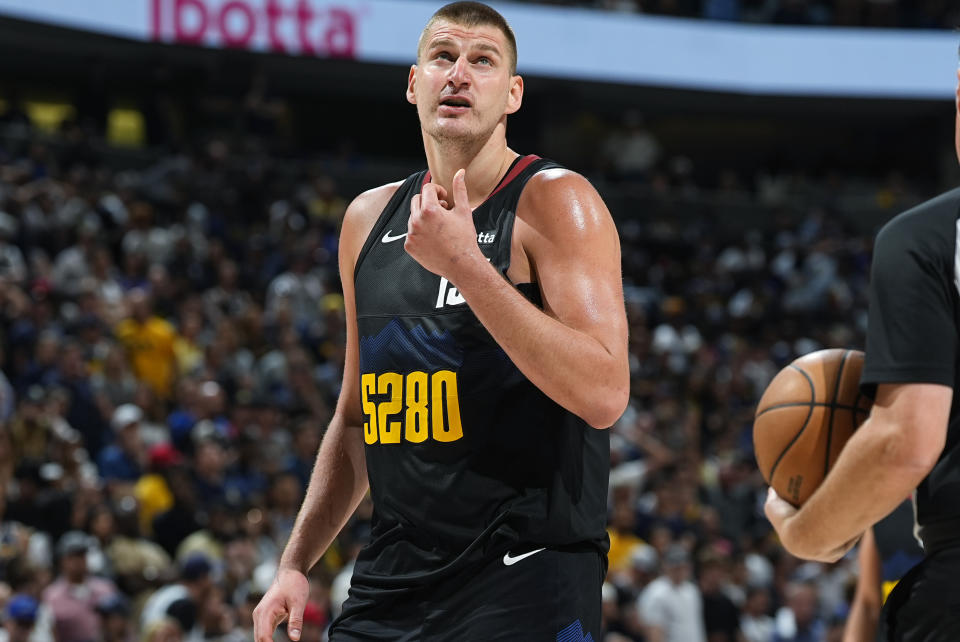 Denver Nuggets center Nikola Jokic checks the clock late in the second half of Game 7 of an NBA second-round playoff series against the Minnesota Timberwolves Sunday, May 19, 2024, in Denver. (AP Photo/David Zalubowski)