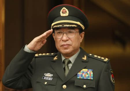 China's Central Military Commission Vice Chairman General Xu Caihou listens to national anthems during a welcome ceremony at the Pentagon in Washington, in this October 27, 2009 file photo. REUTERS/Kevin Lamarque/Files