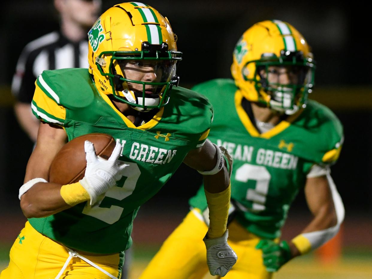 New Deal's Ethan Brown, left, runs with the ball against Farwell, Friday, Aug. 26, 2022, at Noland Stadium in New Deal. 