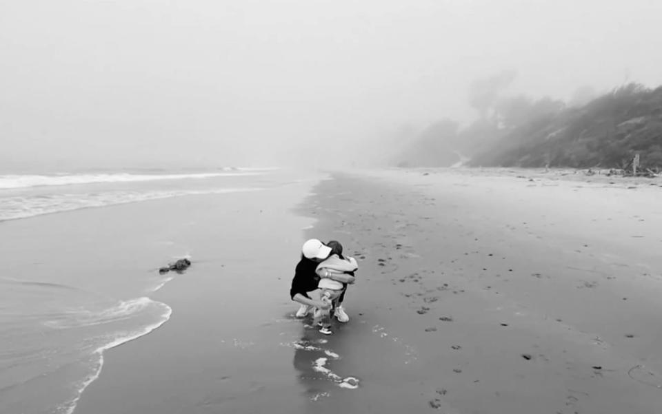 Meghan embracing Archie on the beach - CBS