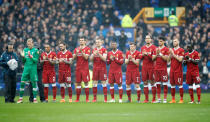 <p>Liverpool players during a minutes applause in memory of Ray Wilkins before the match </p>