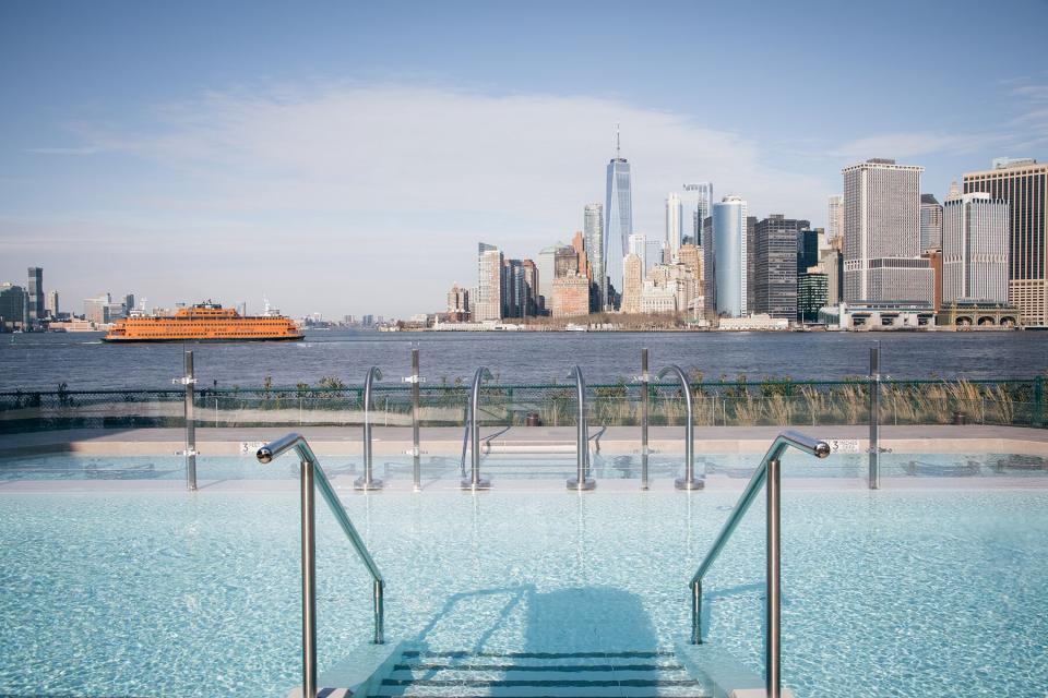 View of the NYC skyline from the outside pool at QC NY Spa on Governors Island