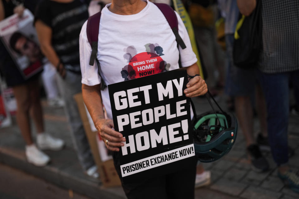 Israelis protest and call for the return of more than 220 people captured by Hamas militants, in Tel Aviv, Israel, Saturday, Oct. 28, 2023. (AP Photo/Bernat Armangue)