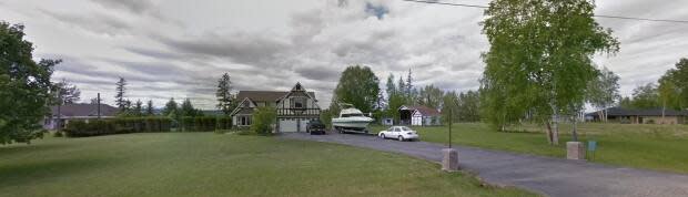 This house is one of four properties under evacuation alert issued by the City of Quesnel on Monday. Another house on the same road is under evacuation order.  (Google Streetview - image credit)