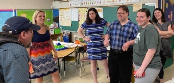 Two former students of Ken Abbott are in the center and are interviewed for "Good Morning America." The two women on the right are family members of the two students. Abbott's daughter, Melissa Staffier, is on the left.