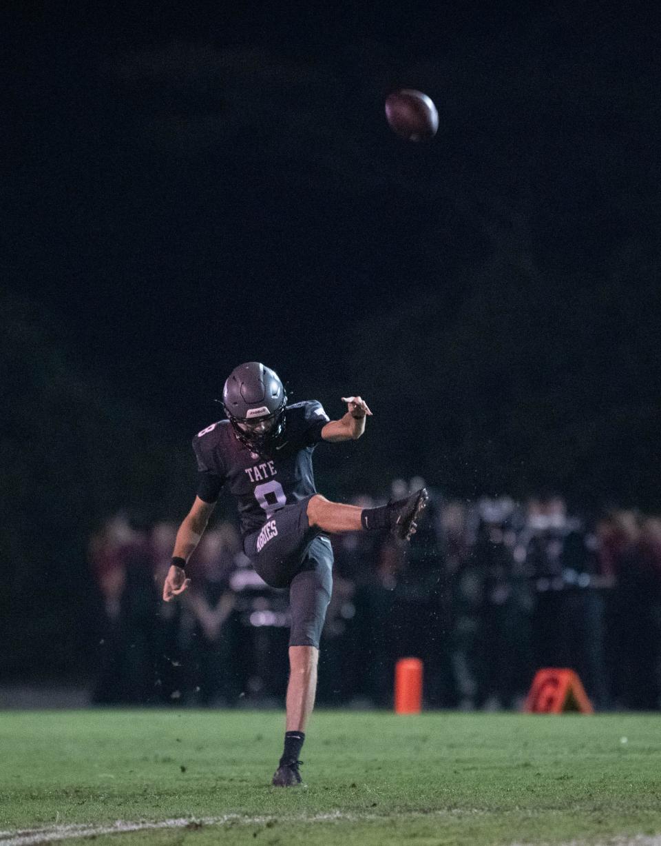 Jackson Clarke (8) punts during the Northview vs Tate football game at Tate High School in Cantonment on Thursday, Sept. 7, 2023.