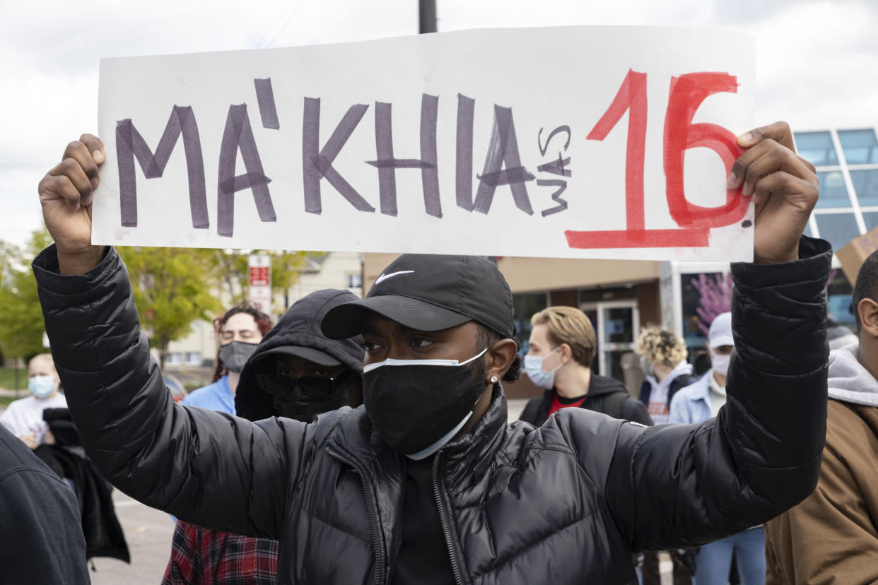 Black Lives Matter activist holds a placard protesting the police killing of Ma'Khia Bryant, 16, during the demonstration. (Photo by Stephen Zenner/SOPA Images/LightRocket via Getty Images)