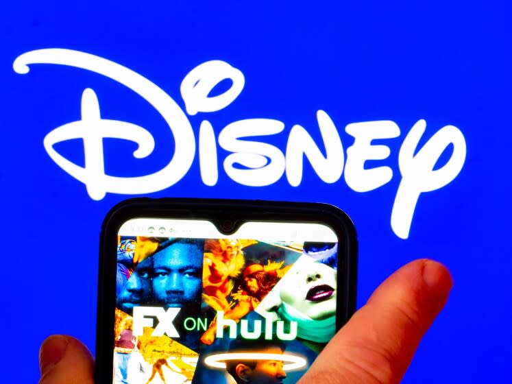 UKRAINE - 2022/02/03: In this photo illustration, the FX on Hulu logo is displayed on a smartphone screen with a Disney logo in the background. (Photo Illustration by Igor Golovniov/SOPA Images/LightRocket via Getty Images)