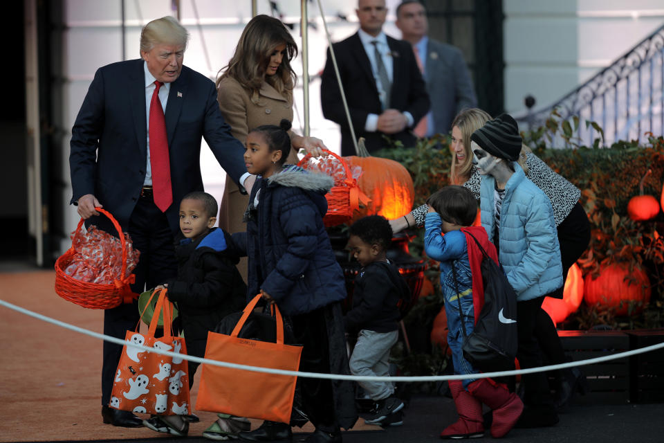 <p>U.S. President Donald Trump and First Lady Melania Trump give out Halloween treats to children at the South Portico of the White House in Washington, D.C. on Oct. 30, 2017. (Photo: Carlos Barria/Reuters) </p>