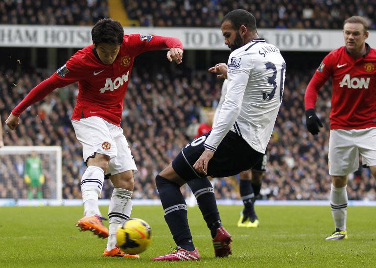 Manchester United's Shinji Kagawa (left) clashes with Tottenham Hotspur's Sandro in a Premier League game at at White Hart Lane in London on December 1, 2013