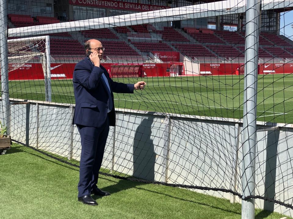 In this Monday, March 9, 2020, Sevilla's President Jose Castro speaks on the phone at the sport center of Sevilla in Seville, Spain. The Seville derby between fierce southern rivals Sevilla and Real Betis will be the match kickstarting the Spanish league's first division this week after a wait of nearly three months because of the coronavirus pandemic. Thursday's highly popular game will be the first in the league since it was suspended on March 12 with 11 rounds left. (AP Photo/Tales Azzoni)