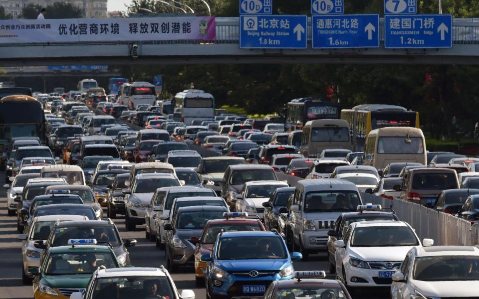 China is the world's largest car market, with about 24.2m cars sold there last year - AFP