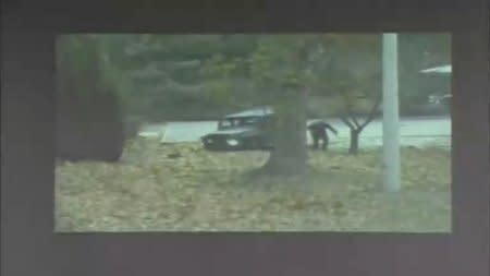 A CCTV footage shows a North Korean soldier running from a vehicle during a United Nations Command (UNC) briefing on the investigation results of the soldier's defection, at the South Korean defence ministry in Seoul in this still image taken from a Reuters TV video, November 22, 2017. REUTERS/Reuters TV