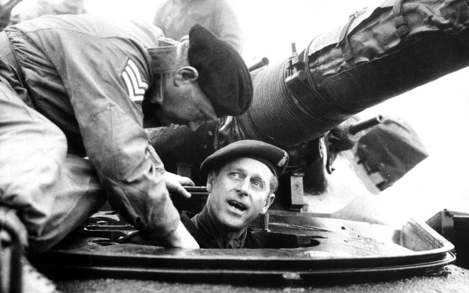 Originally a Royal Prince of Greece and Denmark, Prince Philip renounced his titles shortly before his marriage to Princess Elizabeth in 1947. Pictured is the prince in a Chieftain tank in his role as Colonel-in-Chief of Queen's Royal Irish Hussars on March 20, 1969 - KEYSTONE USA / eyevine