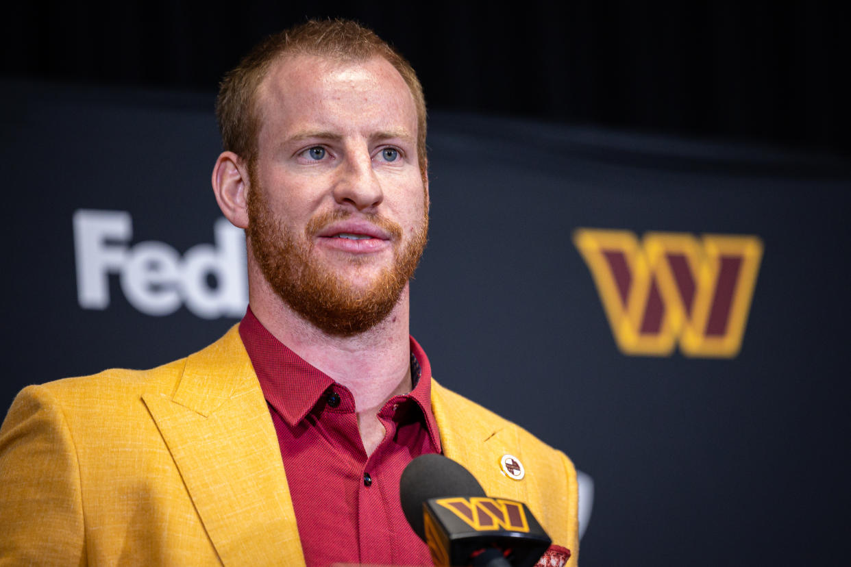 ASHBURN, VA - MARCH 17: Quarterback Carson Wentz of the Washington Commanders is introduced at Inova Sports Performance Center on March 17, 2022 in Ashburn, Virginia. (Photo by Scott Taetsch/Getty Images)