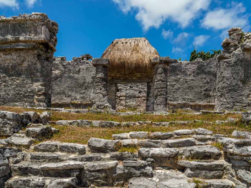 Mayan ruins in Tulum on a partly-cloudy day