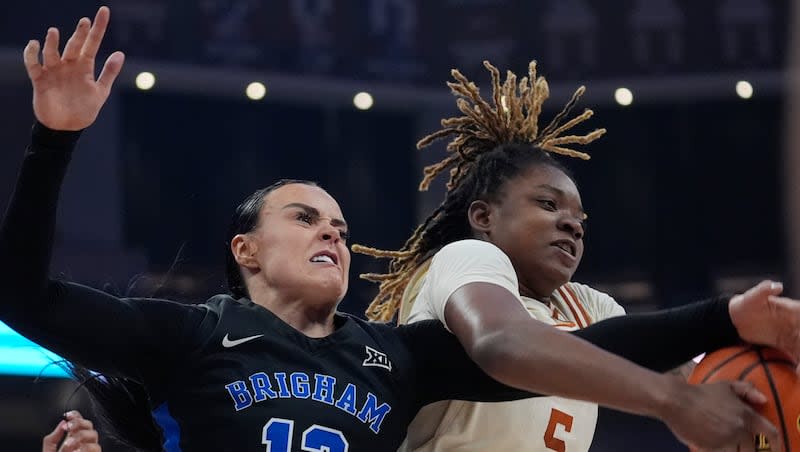 BYU forward Lauren Gustin (12) and Texas forward DeYona Gaston (5) battle for a rebound during a game in Austin, Texas, Saturday, March 2, 2024.