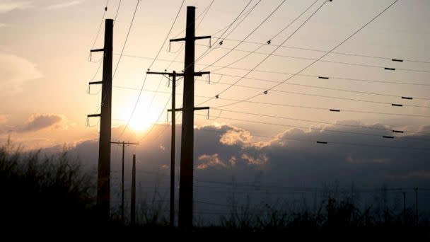 PHOTO: The sun sets behind power transmission lines in Houston, Texas, July 11, 2022. (Nick Wagner/Xinhua/Newscom)