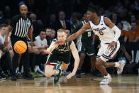 Michigan State forward Joey Hauser (10) and Kansas State guard Cam Carter (5) chase the loose ball in the second half of a Sweet 16 college basketball game in the East Regional of the NCAA tournament at Madison Square Garden, Thursday, March 23, 2023, in New York. (AP Photo/Frank Franklin II)