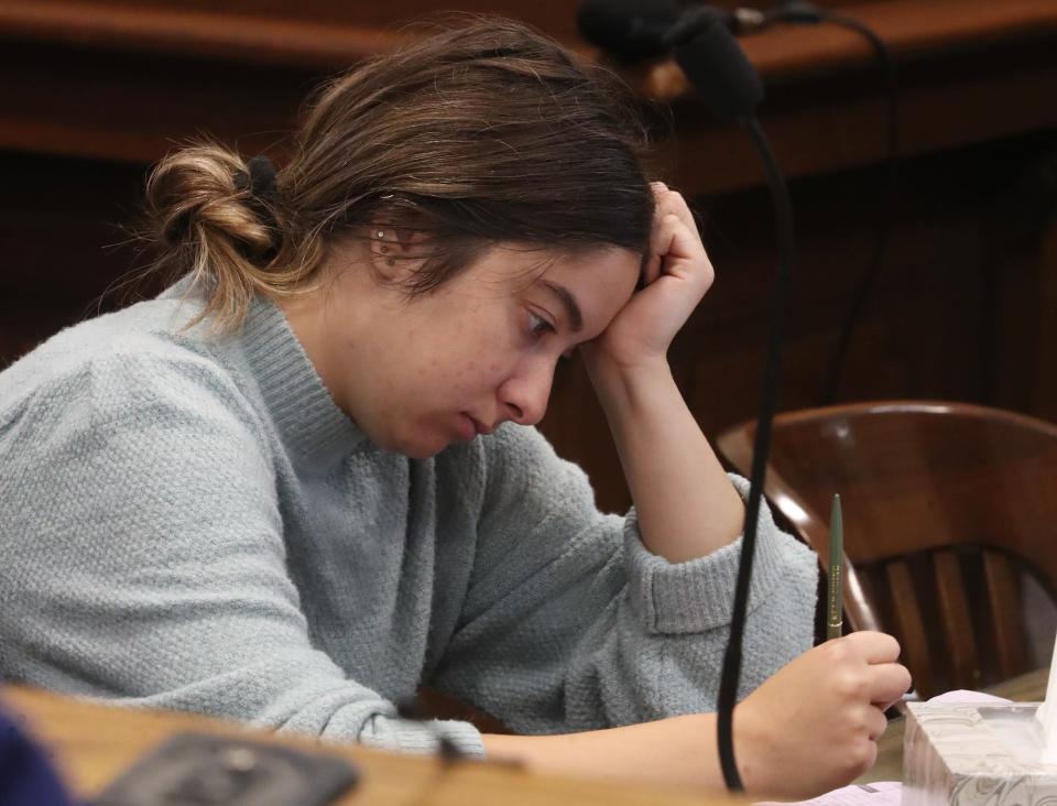 Sydney Powell listens as psychologist James Reardon testifies about his examinations of Powell during her trial in Summit County Common Pleas Judge Kelly McLaughlin's courtroom. Powell is on trial for the stabbing death of her mother.