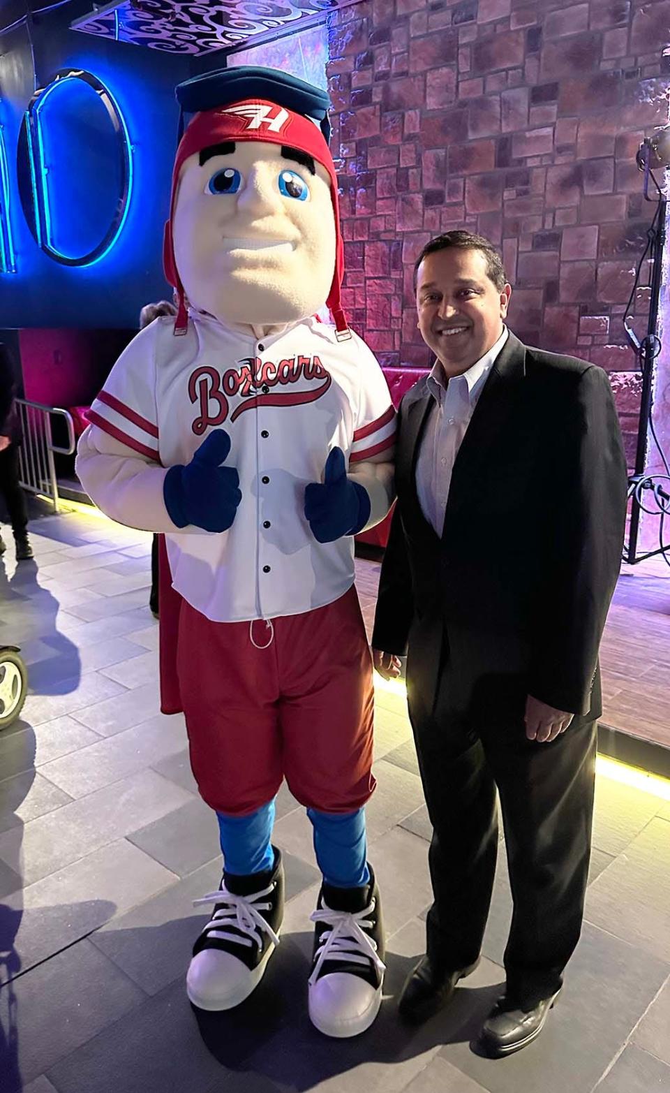 Stryker, the Hagerstown Flying Boxcars' mascot, poses for a photo with Meritus Health President and CEO Maulik Joshi during a press conference and private event at Seven Ten in Hagerstown on Feb. 13, 2024.