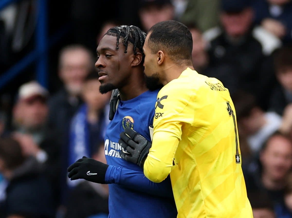 Axel Disasi is consoled by Robert Sanchez after his own goal (Action Images/Reuters)