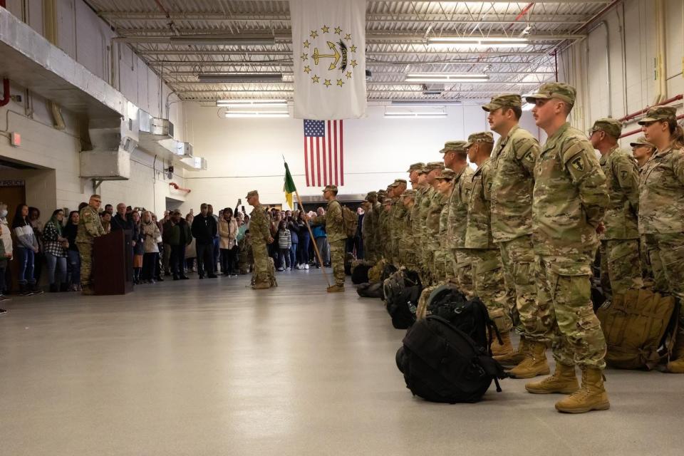 Members of the Rhode Island National Guard 43rd Military Police Brigade gathered with family for a departure ceremony in 2022. A bill filed by R.I. state Sen. Linda Ujifusa would extend property tax exemptions to members of the National Guard.