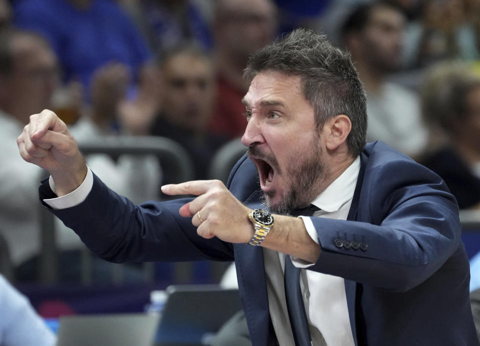 Italy's head coach Gianmarco Pozzecco celebrates during the Eurobasket quarter final basketball match between France and Italy in Berlin, Germany, Wednesday, Sept. 14, 2022. (AP Photo/Michael Sohn)