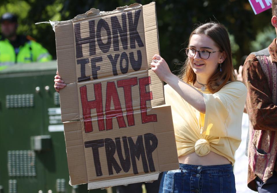 “Honk if you hate Trump.”