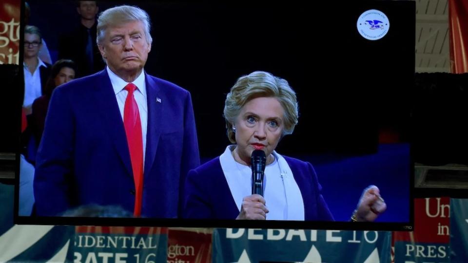 Donald Trump lurked behind Hillary Clinton during their October 9, 2016 debate (CREDIT: Timothy A. Clary/ AFP)