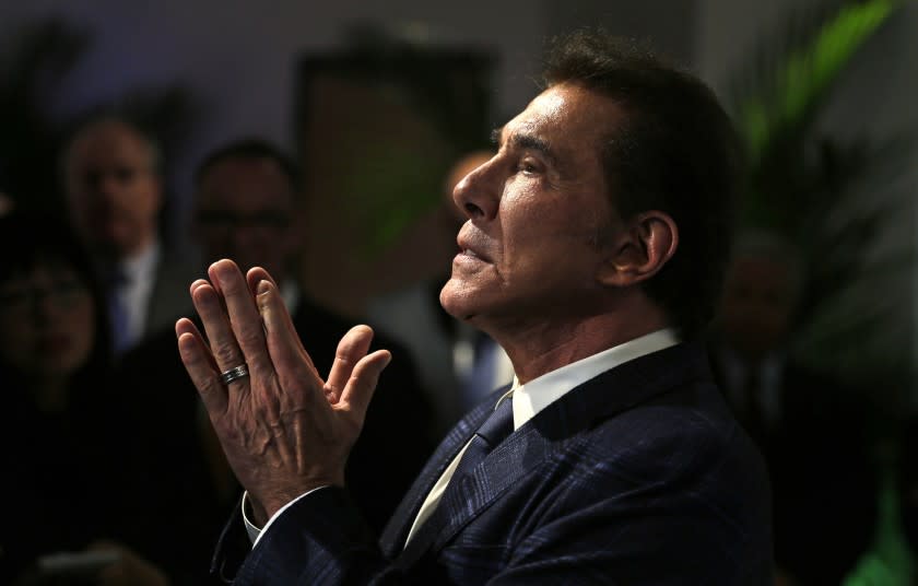 FILE - In this March 15, 2016, file photo, former Las Vegas casino mogul Steve Wynn gestures during a news conference in Medford, Mass. Wynn won a battle in a legal fight about whether Nevada gambling regulators can fine him over allegations of workplace sexual misconduct even though he no longer is licensed or involved in the gambling industry. A Wynn attorney declined Monday, Nov. 23, 2020, to comment about a state court judge's finding that because Wynn has no ties to the casino business, the state Gaming Commission and Gaming Control Board have no jurisdiction over him. (AP Photo/Charles Krupa, File)