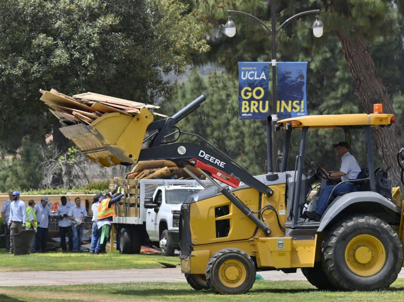 Workers clear debris from a pro-Palestine encampment after hundreds of law enforcement officers clad in riot gear breached and dismantled the camp at UCLA in Los Angeles on Thursday. Photo by Jim Ruymen/UPI